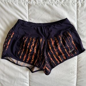 Nike Women's Black and Orange Patterned Athletic Shorts